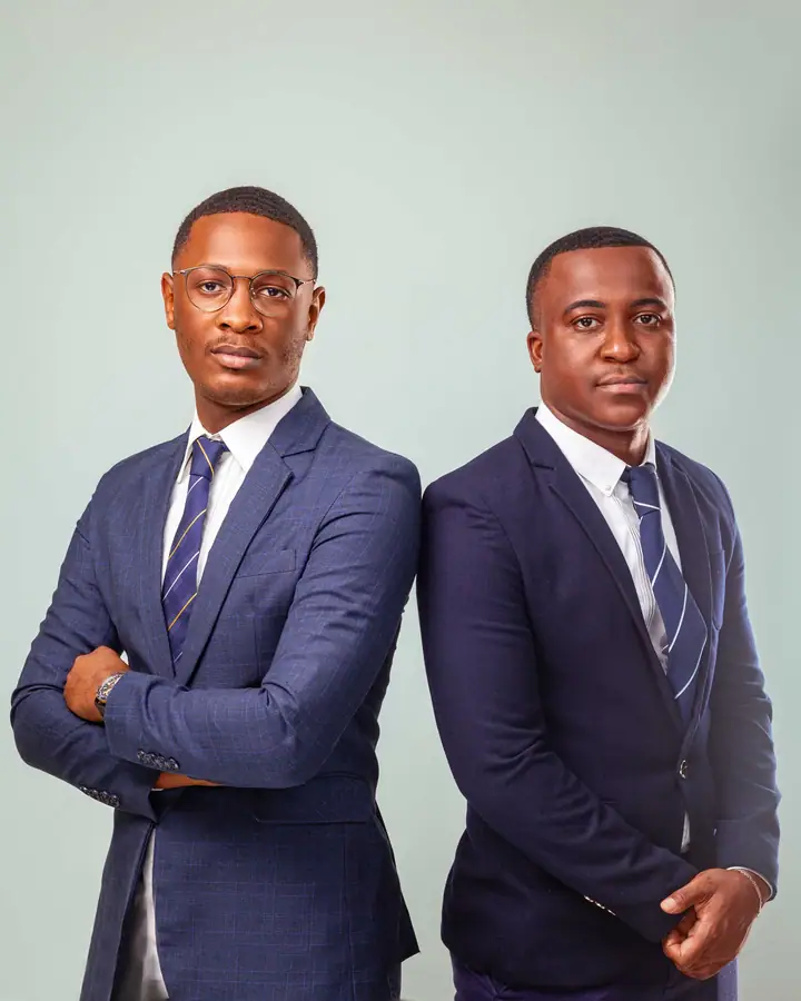 Two guests in navy suits