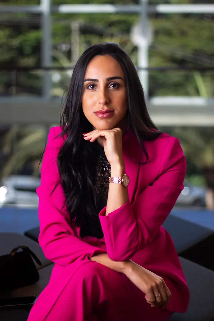 A guest in an elegant pink suit